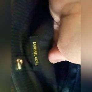 Black Michael Kors hand bag.